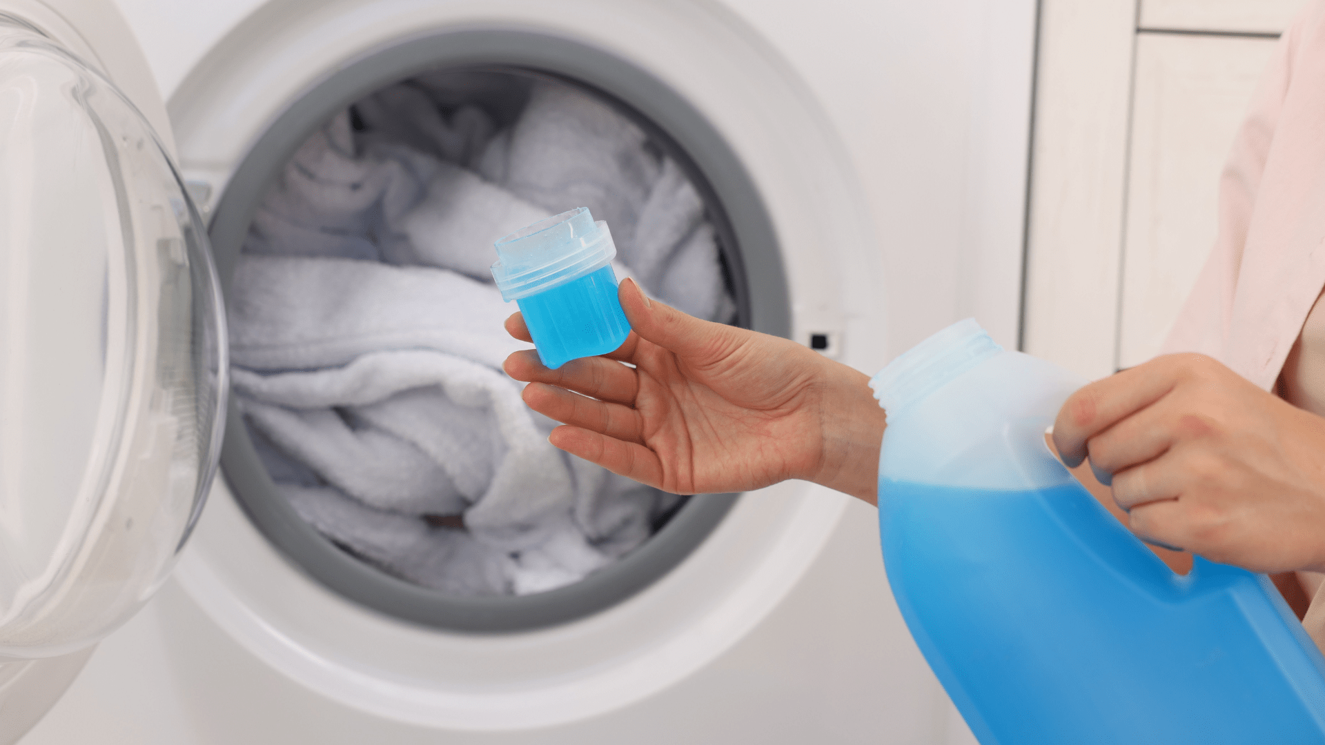 Homeowner maintaining washing machine to extend washing machine's life