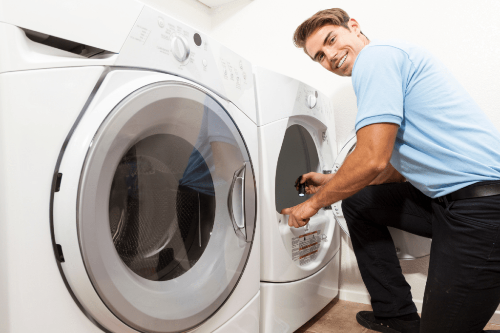 Dryer repair technician diagnosing a broken dryer