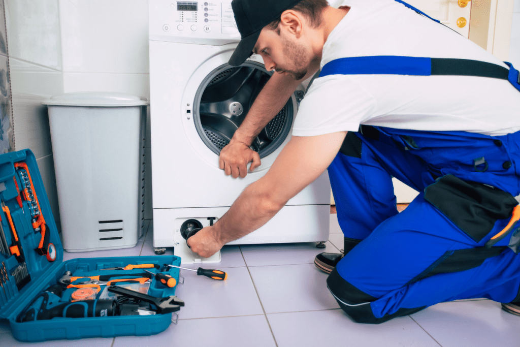 Technician checking a filter for washer repair