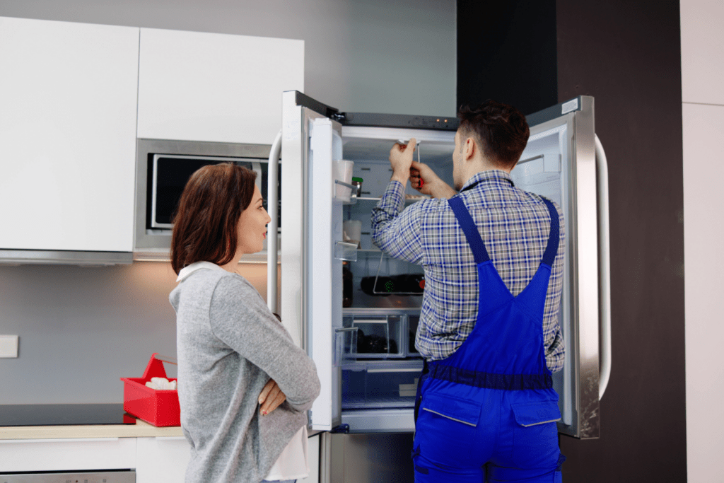 Appliance repair technician servicing refrigerators in New Carrollton, MD with appliance repair in New Carrollton MD