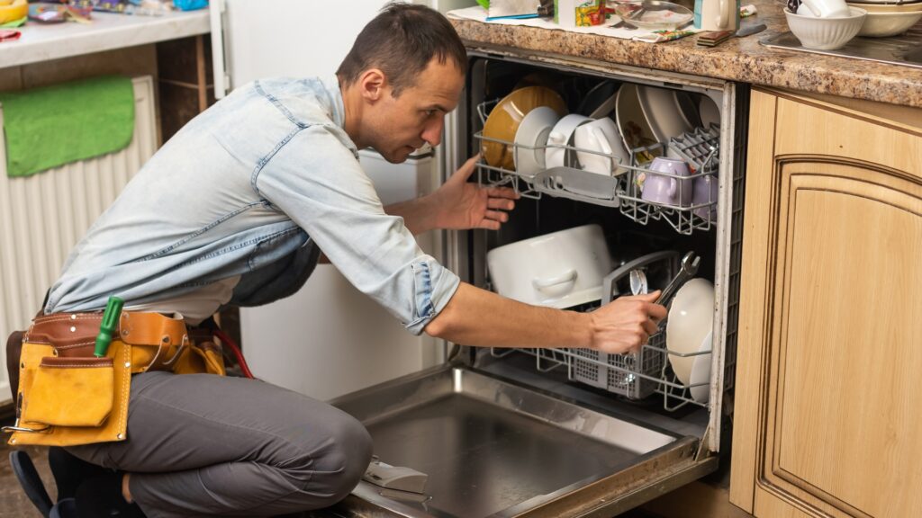 Technician repairing a dishwasher for appliance repair in Cloverly MD