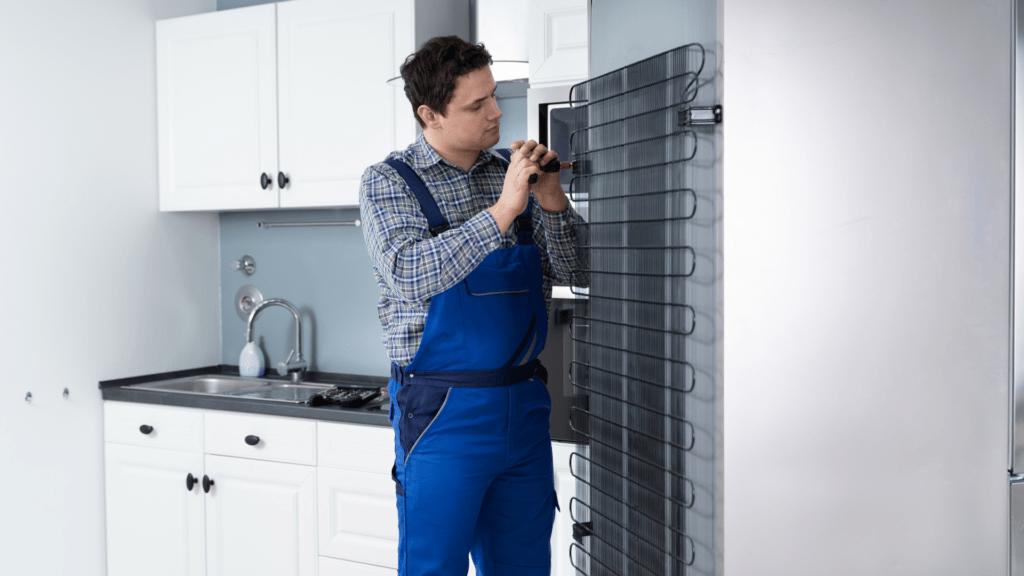 Technician repairing a refrigerator in a home for appliance repair in Georgetown DC