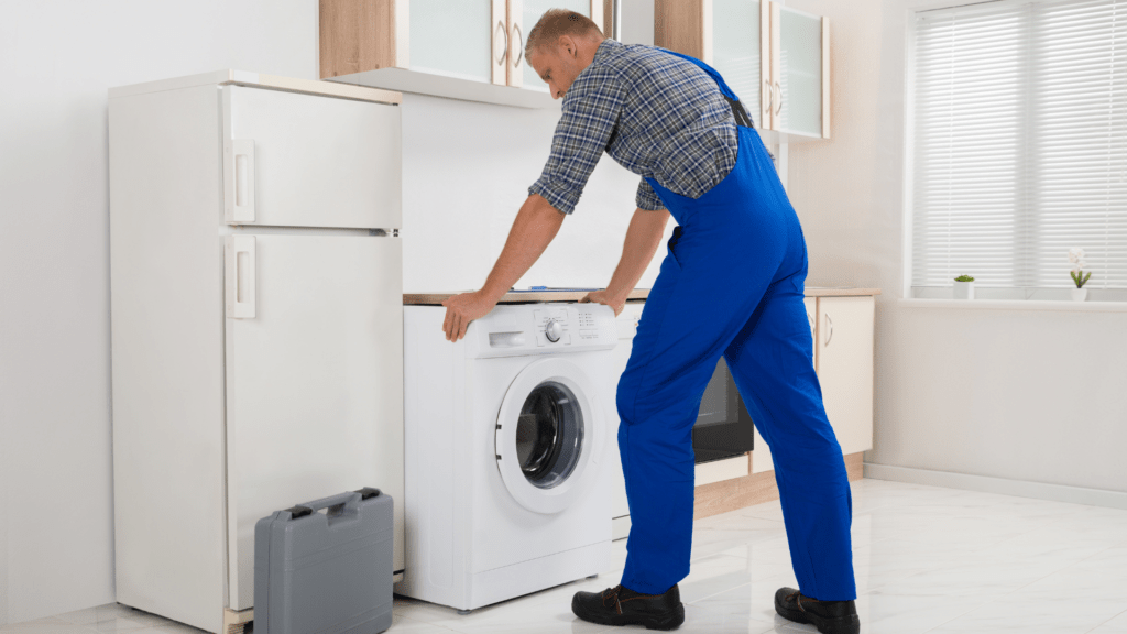 Technician inspecting a washer for appliance repair in Highland MD