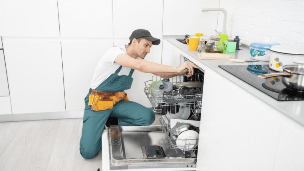 Technician inspecting a dishwasher door for appliance repair in North Laurel MD