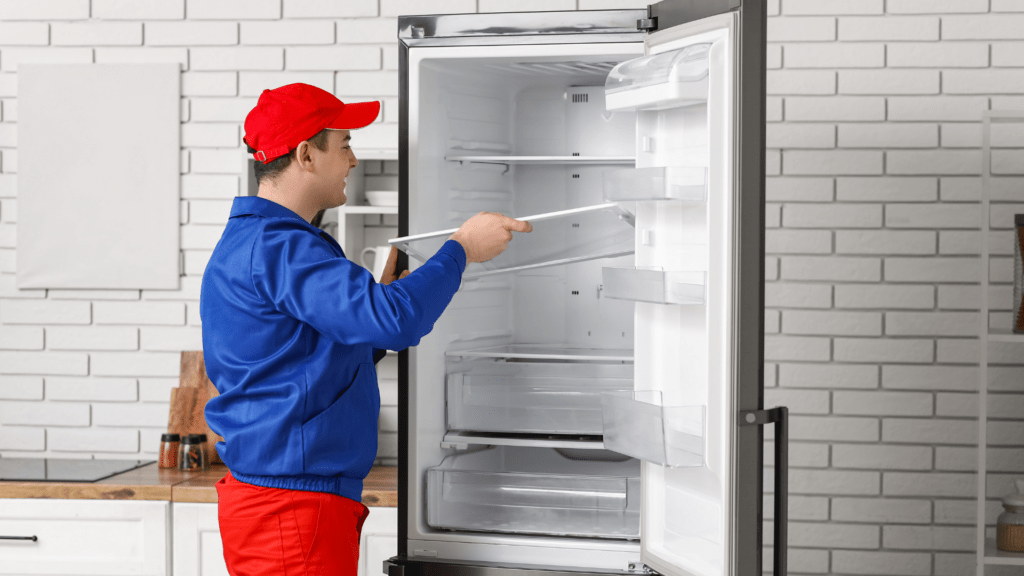 Technician repairing refrigerator shelves for appliance repair in Leesburg VA