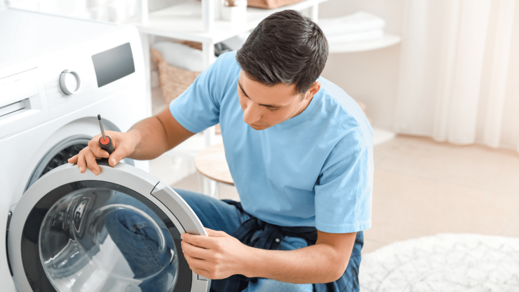 Technician inspecting a washer door for appliance repair in Monrovia MD