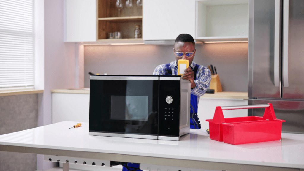Technician testing a microwave for appliance repair in Lovettsville VA
