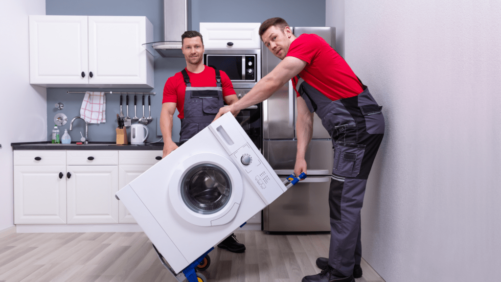 Two technicians installing a new washer for appliance repair in Lorton VA