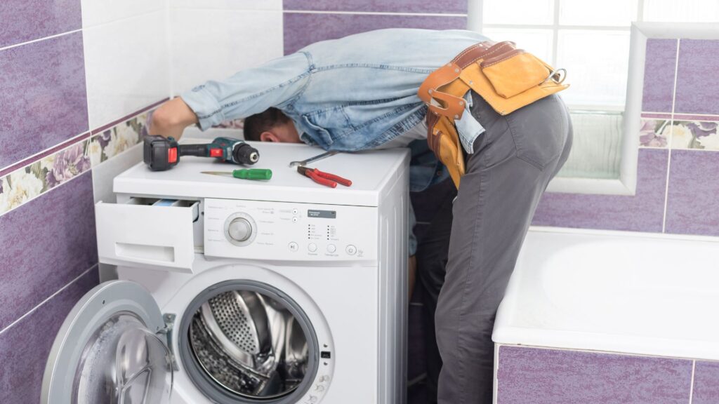 Technician repairing a dryer for appliance repair in Chevy Chase Village MD