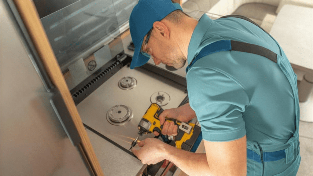Technician installing stove parts for appliance repair in Upper Marlboro MD