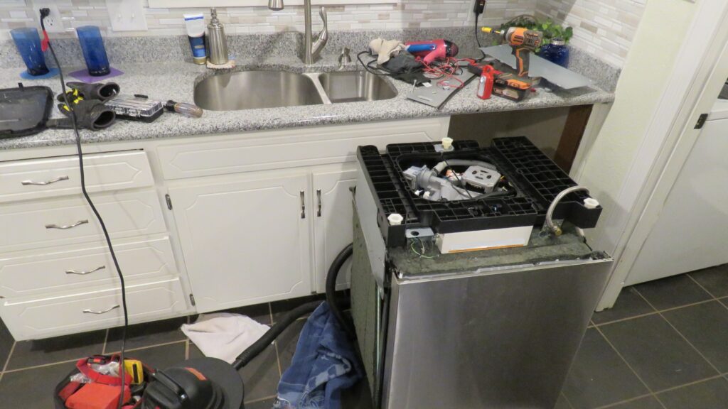 Technician repairing a kitchen dishwasher for appliance repair in Broadlands VA