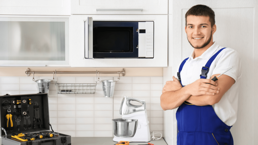 Technician repairing a microwave for appliance repair in Scaggsville MD