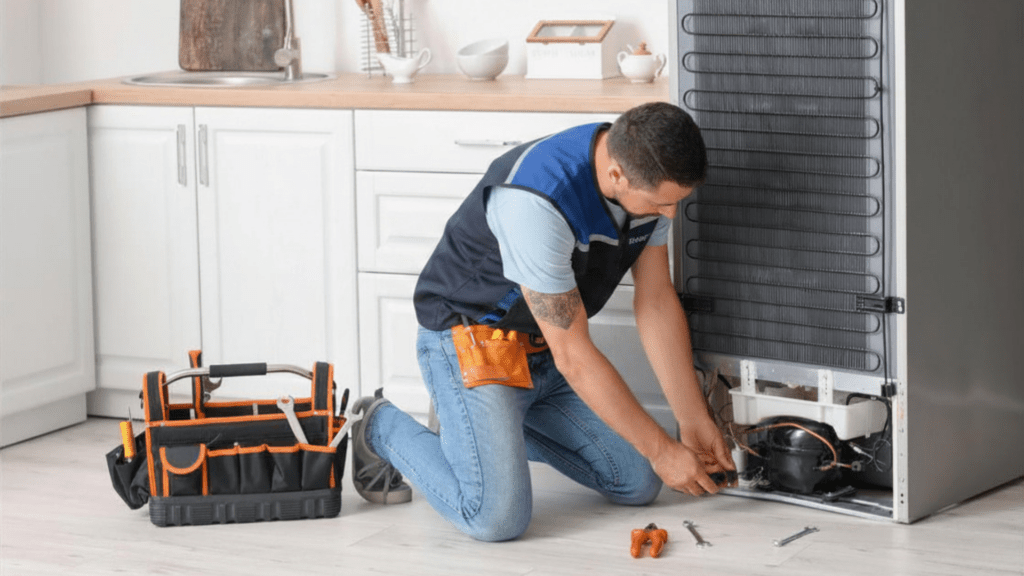 Technician Repairing Refrigerator for Appliance Repair in Springfield VA