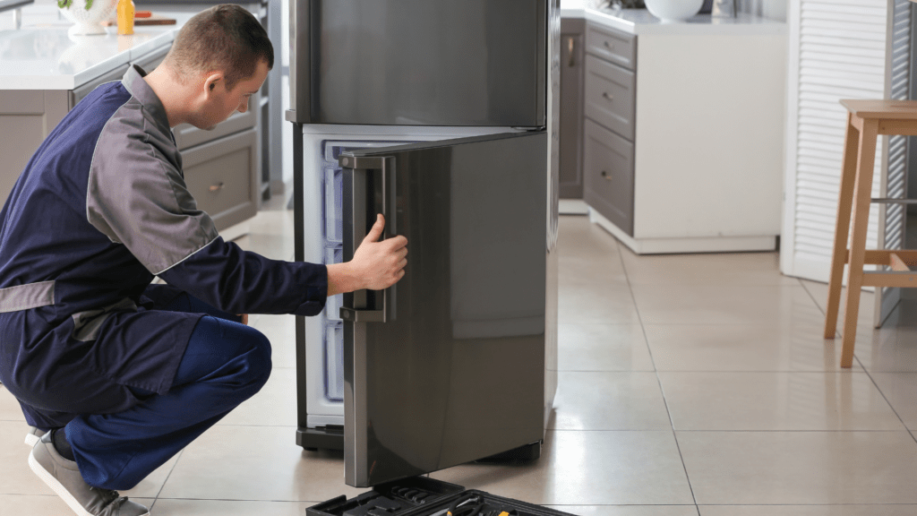 Technician diagnosing a refrigerator problem for appliance repair in Purcellville VA