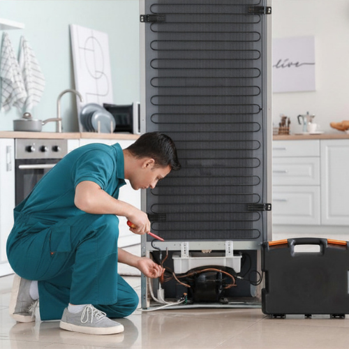 Technician diagnosing a refrigerator problem for appliance repair in Oxon Hill MD