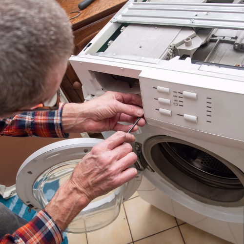 Technician repairing a washing machine for appliance repair in Chillum MD