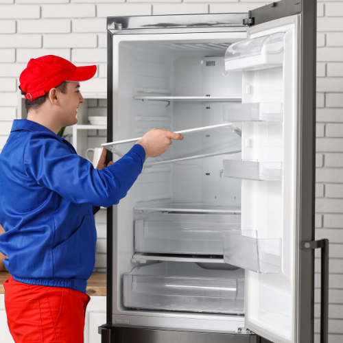 Technician Fixing Refrigerator Shelves for Appliance Repair in Leesburg VA