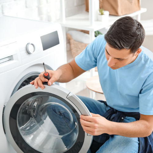 Technician inspecting a washer door for appliance repair in Monrovia MD