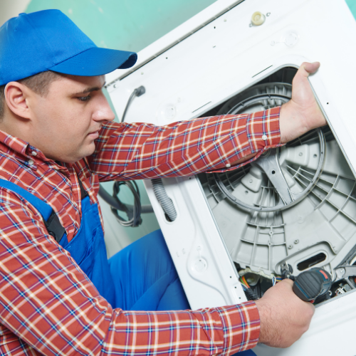 Technician replacing a washing machine motor for appliance repair in National Harbor MD