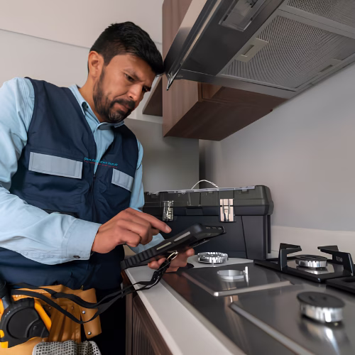 appliance repair in bartonsville md technician checking cooktop