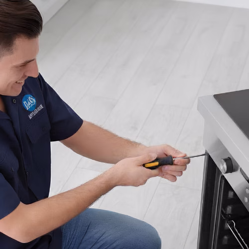 Technician diagnosing an oven for appliance repair in Chevy Chase MD