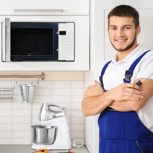 Technician repairing a microwave for appliance repair in Scaggsville MD
