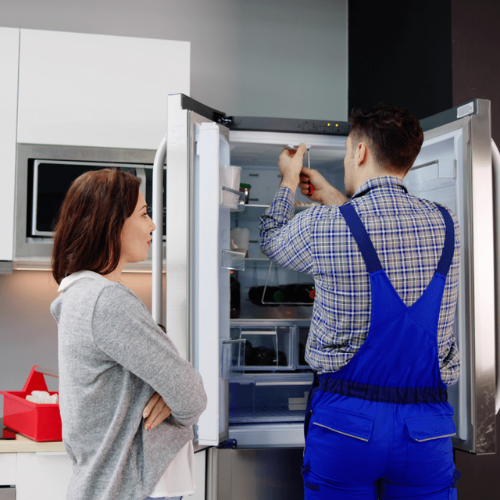 Appliance repair technician servicing refrigerators in New Carrollton, MD with appliance repair in New Carrollton MD