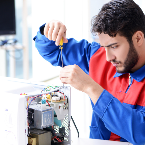 Technician repairing a microwave for appliance repair in South Laurel MD